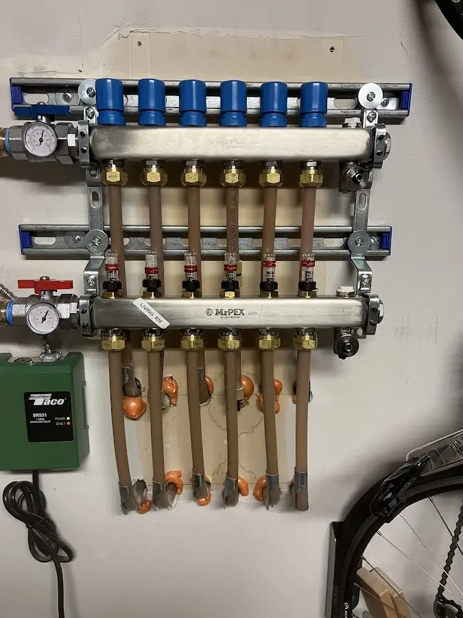 Plumber performing Water Heater Repair at a residential property in Trafford